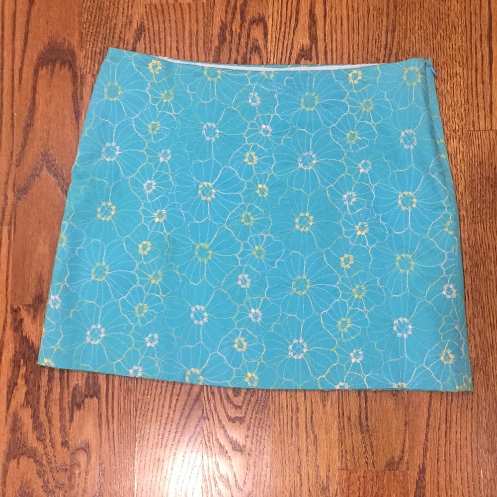 Blue mini skirt with white and yellow flowers